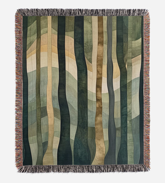 a blanket with a pattern of trees on it